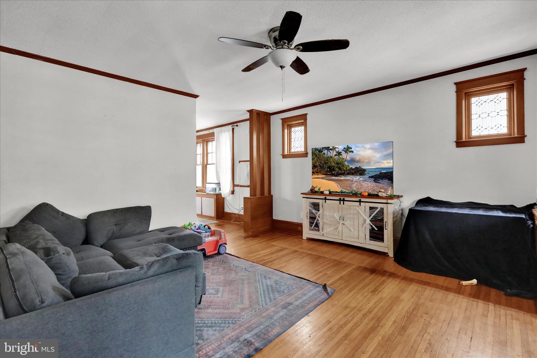 1722 Olive Street Reading, PA 19604 - Photo 4 of 31 a living room with furniture and a large window