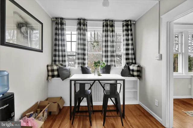 a view of a dining room with furniture window and wooden floor