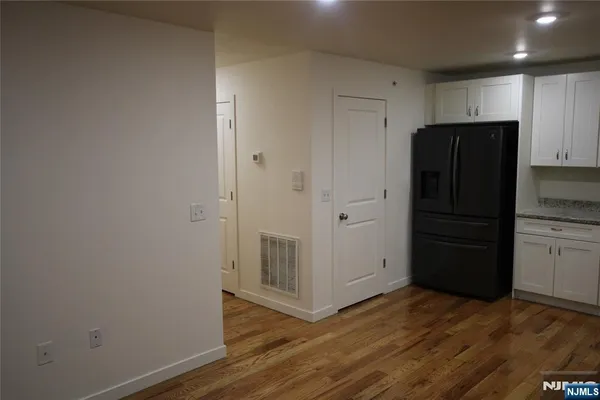 an empty room with wooden floor