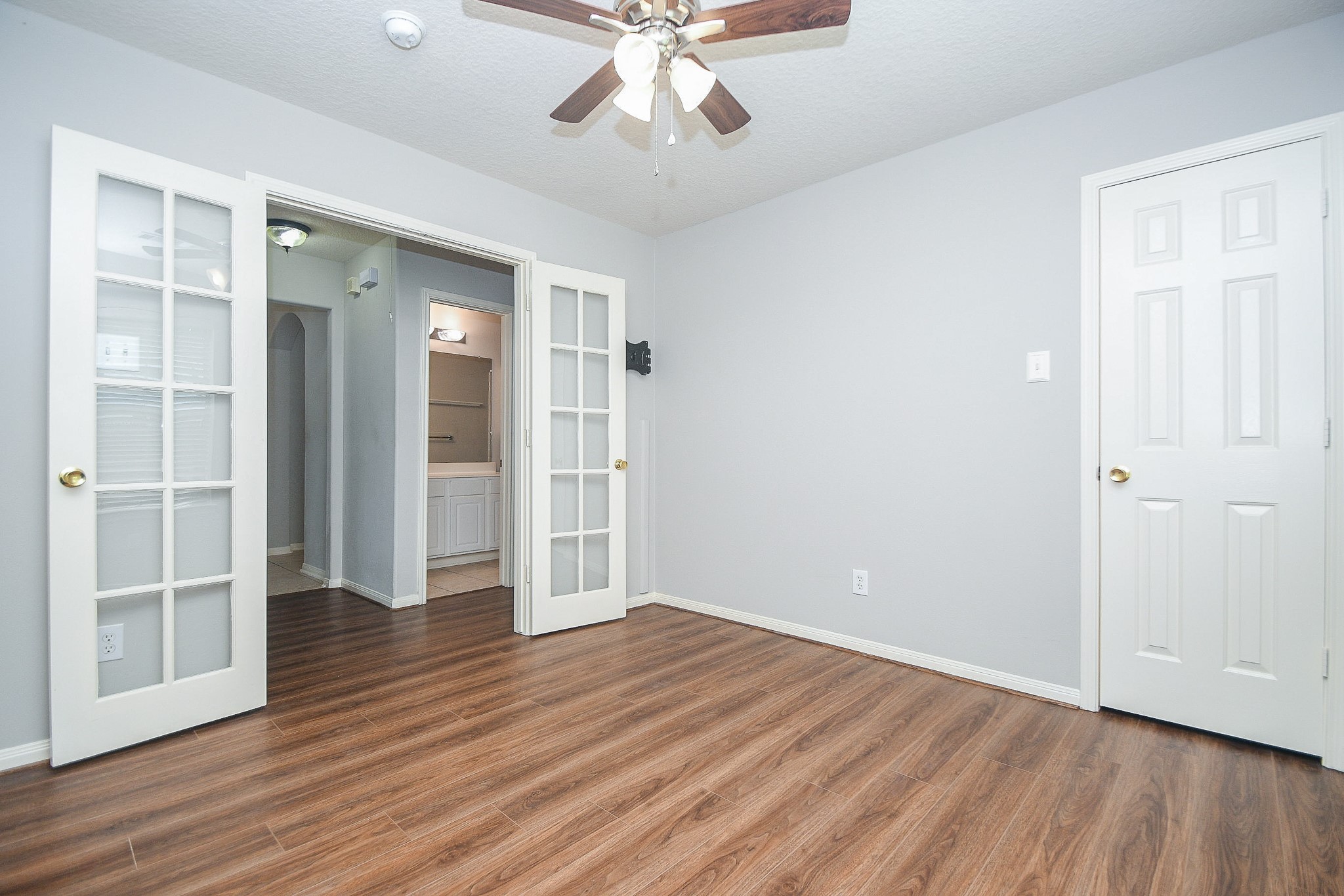 707 New Pines Drive Spring, TX 77373 - Photo 14 of 33 wooden floor in an empty room with a window