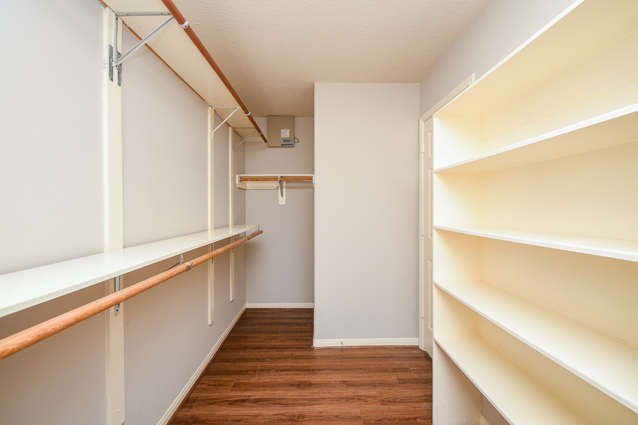 707 New Pines Drive Spring, TX 77373 - Photo 20 of 33 a view of walk in closet with wooden floor