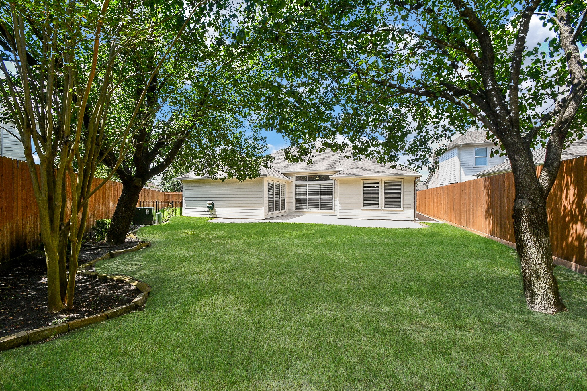 707 New Pines Drive Spring, TX 77373 - Photo 26 of 33 a front view of a house with a yard