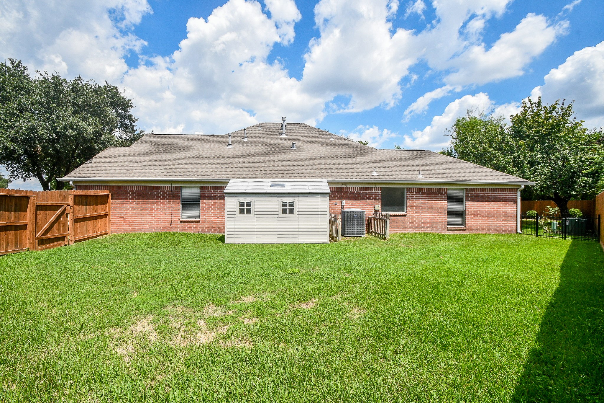 707 New Pines Drive Spring, TX 77373 - Photo 28 of 33 a view of a house with backyard and garden
