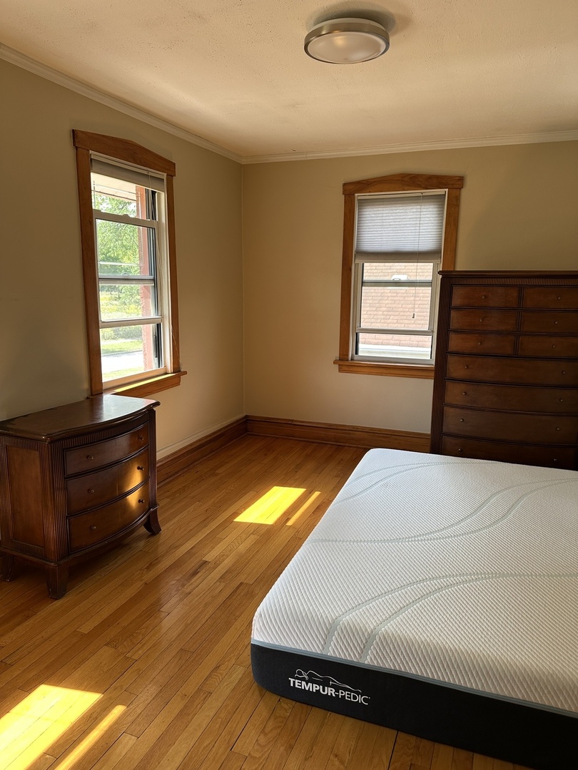 192 Waubansee Road Riverside, IL 60546 - Photo 11 of 19 a bedroom with a bed and a window