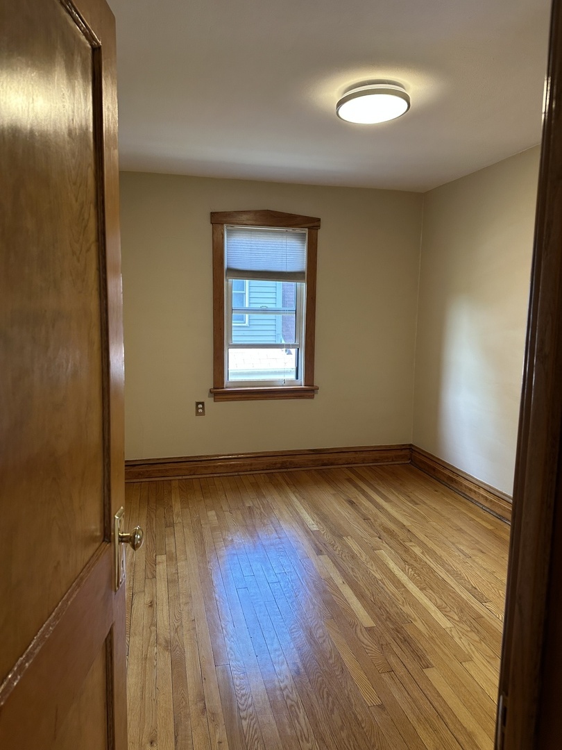 192 Waubansee Road Riverside, IL 60546 - Photo 13 of 19 a view of an empty room and wooden floor