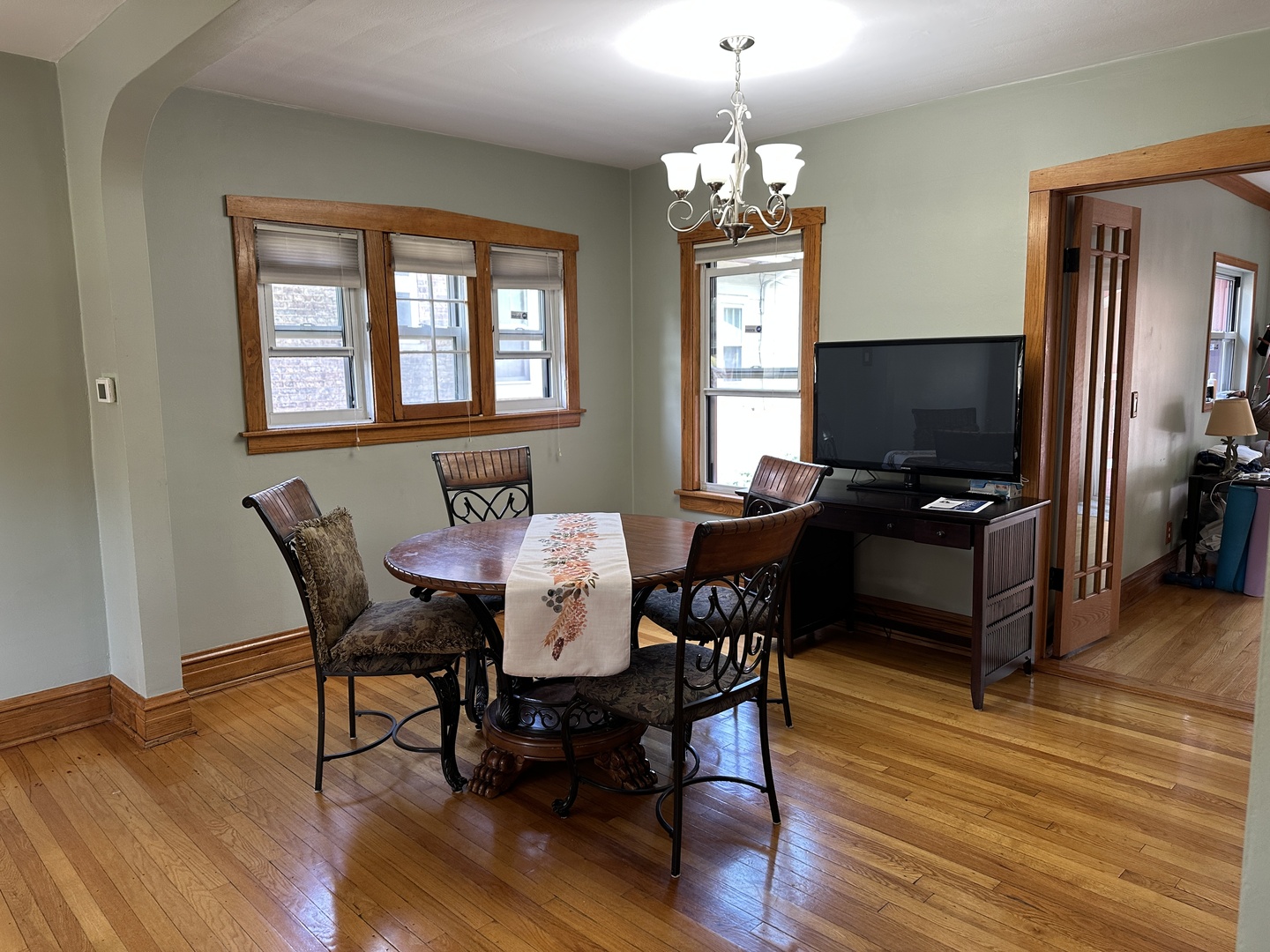 192 Waubansee Road Riverside, IL 60546 - Photo 5 of 19 a view of a dining room with furniture a chandelier and wooden floor