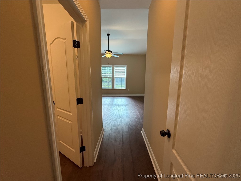 Undisclosed Address Spring Lake, NC 28390 - Photo 13 of 22 a view of a hallway with wooden floor