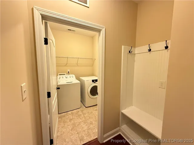 a bathroom with a tub and a shower