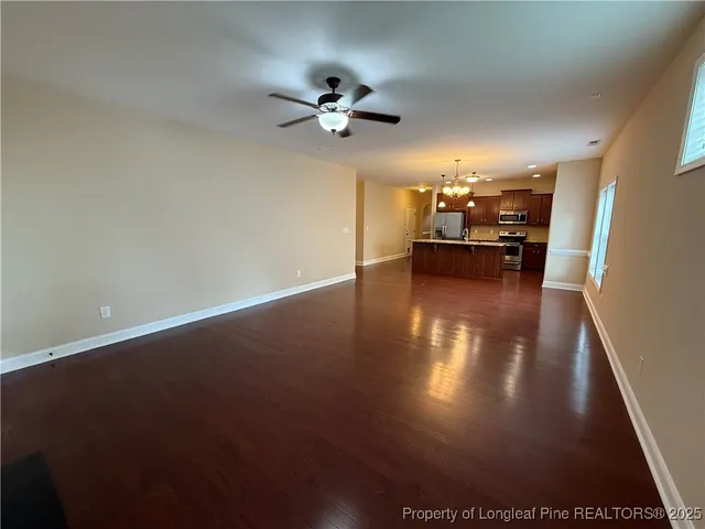 a view of a livingroom with furniture nad wooden floor