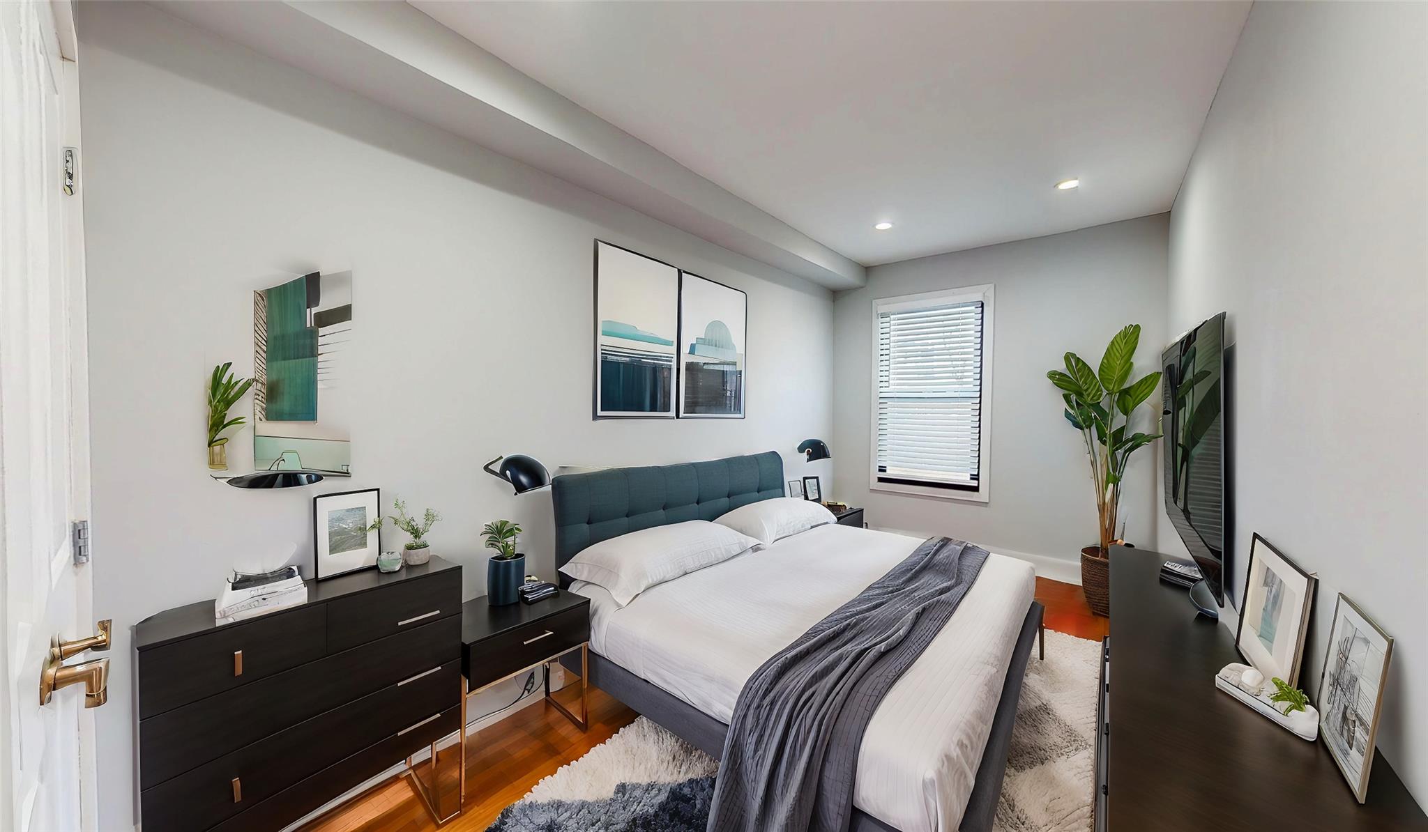235 Sumpter Street Brooklyn, NY 11233 - Photo 2 of 7 Bedroom featuring recessed lighting, baseboards, and wood finished floors