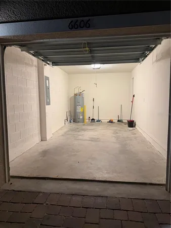 a view of a utility room with wooden floor