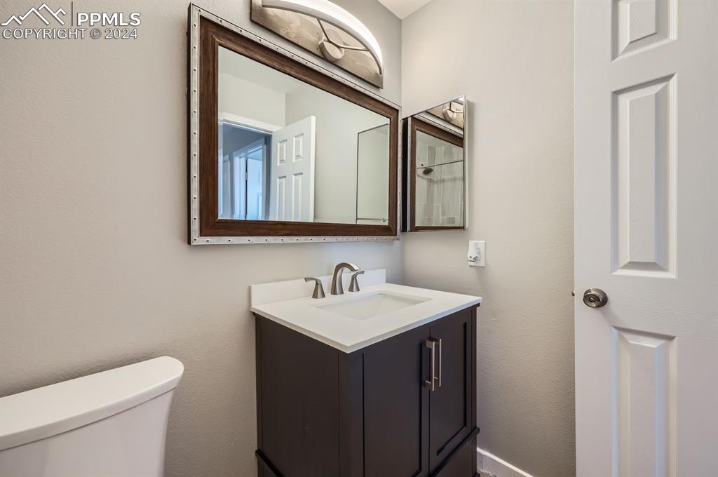 359 Ellers Grove Colorado Springs, CO 80916 - Photo 19 of 27 Bathroom featuring vanity and toilet