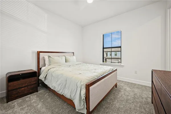 a bedroom with a bed and a cabinets