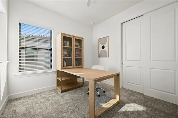 a workspace with furniture and window
