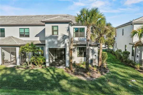 a view of house with yard