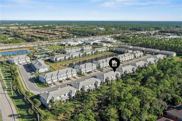 an aerial view of multiple house with yard