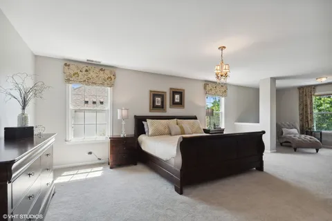 a bed room with a bed and furniture