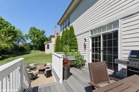 a view of a house with backyard sitting area and garden