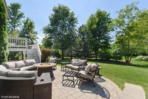 a view of backyard with seating area and green space