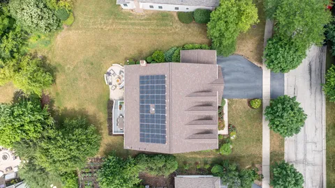 front view of a house with a garden