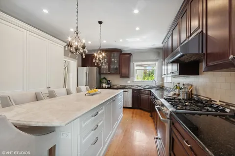 a kitchen with a sink stove and microwave