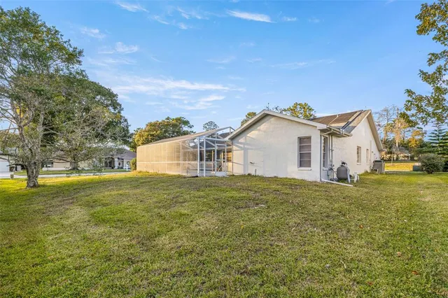 a big house with a big yard and large trees