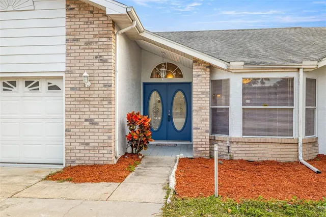 a front view of a house with parking