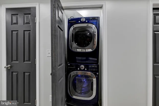 a view of a hallway with washer and dryer