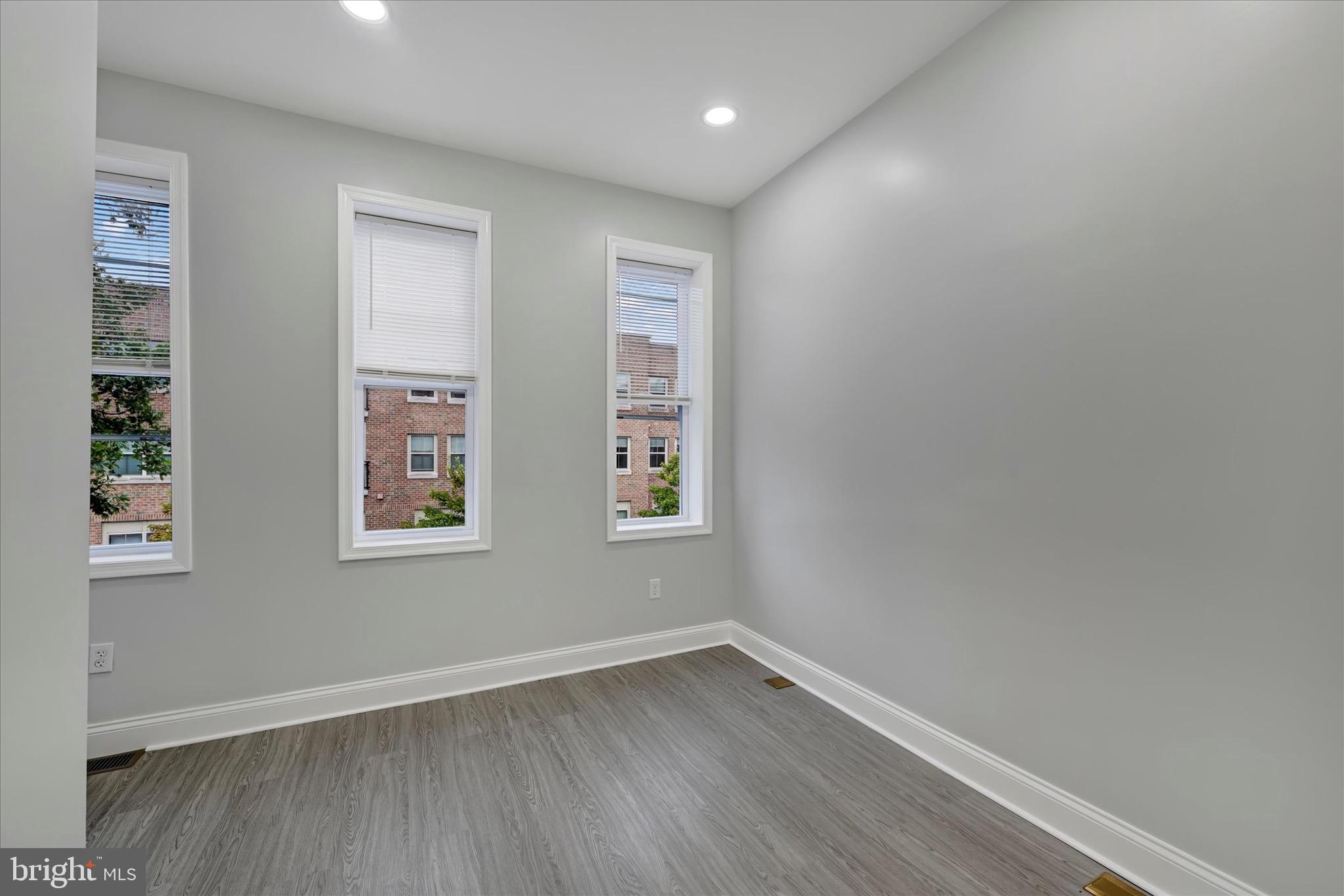 531 Wilson Street Baltimore, MD 21217 - Photo 19 of 24 wooden floor in an empty room with a window