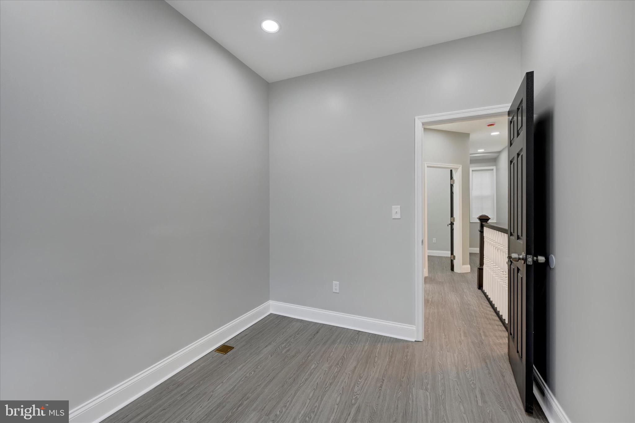 531 Wilson Street Baltimore, MD 21217 - Photo 20 of 24 a view of a room with wooden floor and a small space