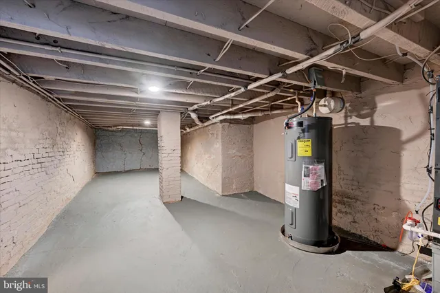 a view of empty room with wooden walls