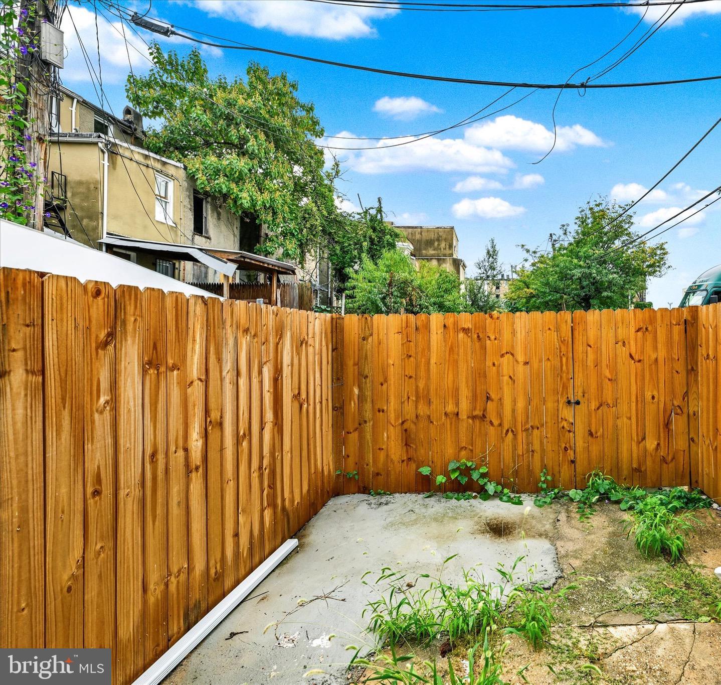 531 Wilson Street Baltimore, MD 21217 - Photo 23 of 24 a view of small yard with wooden fence