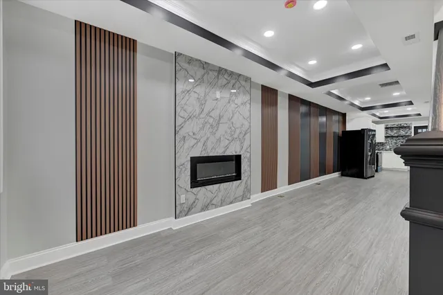 a view of a kitchen with a sink and a refrigerator