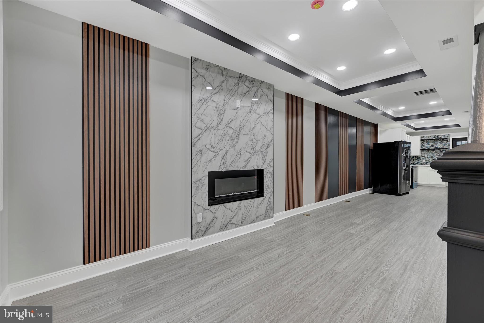 531 Wilson Street Baltimore, MD 21217 - Photo 3 of 24 a view of a kitchen with a sink and a refrigerator
