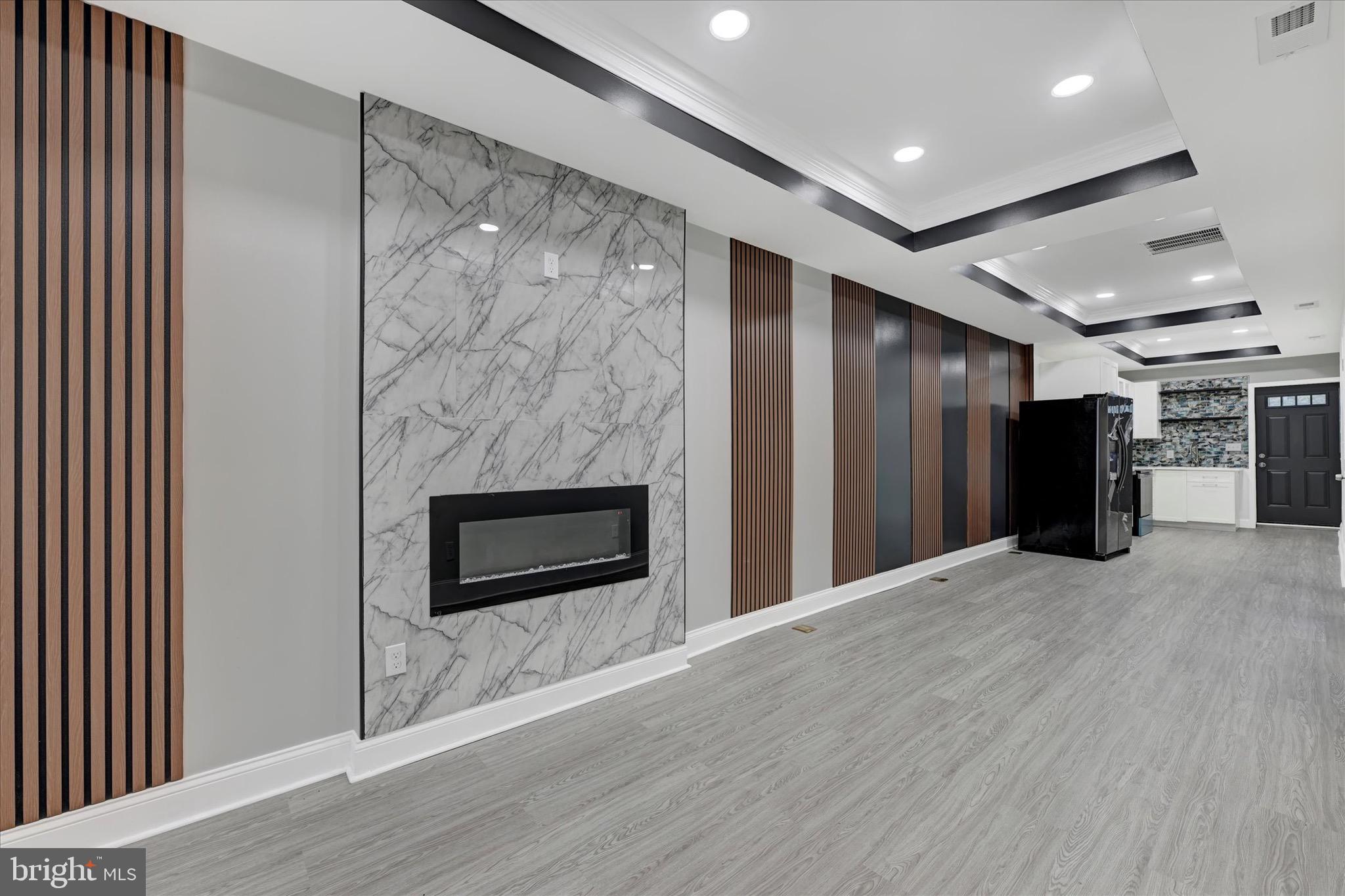 531 Wilson Street Baltimore, MD 21217 - Photo 5 of 24 a view of a livingroom with a fireplace