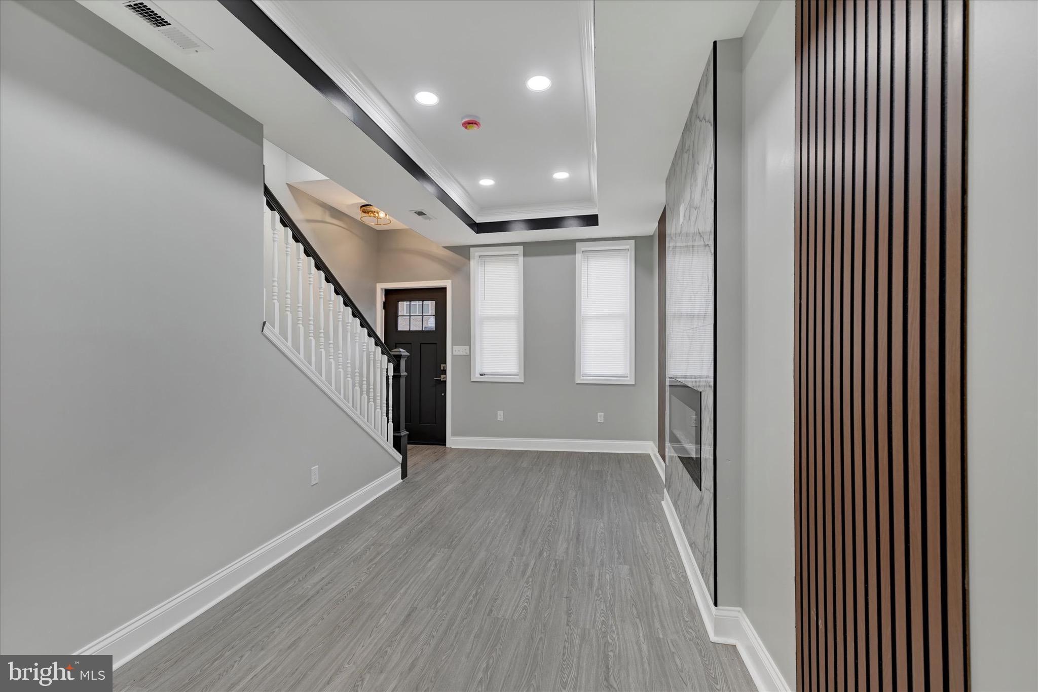 531 Wilson Street Baltimore, MD 21217 - Photo 7 of 24 a view of a hallway with wooden floor
