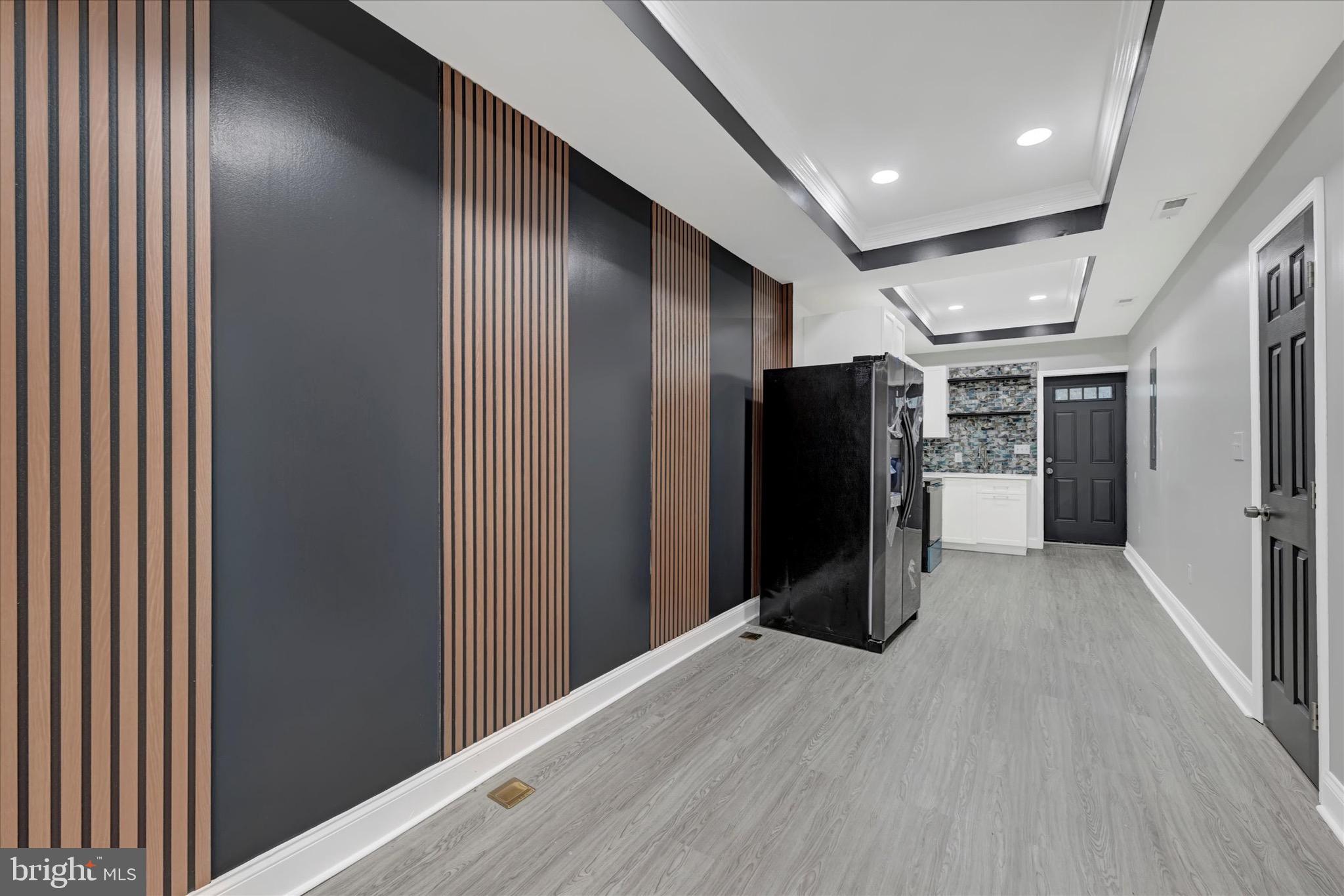 531 Wilson Street Baltimore, MD 21217 - Photo 8 of 24 a view of a refrigerator in kitchen and wooden floor