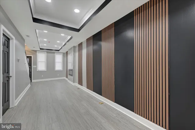 a view of hallway with wooden floor