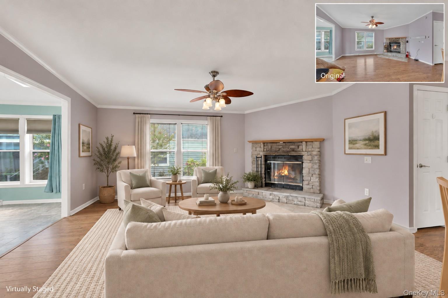 9 Rivercrest Road, Unit 15 Fort Montgomery, NY 10922 - Photo 6 of 45 Wood-finish flooring throughout, stone-clad fireplace with mantel, ceiling fan with integrated lighting, and crown molding accents