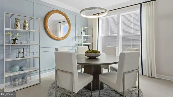 a view of a livingroom with furniture and a mirror