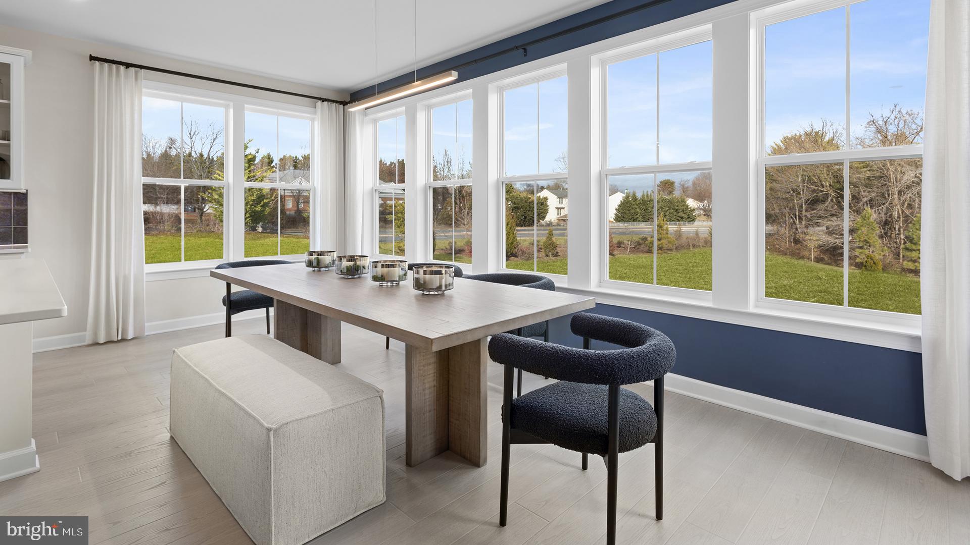 830 Reagans Road Frederick, MD 21702 - Photo 5 of 24 a dining room with furniture and large windows
