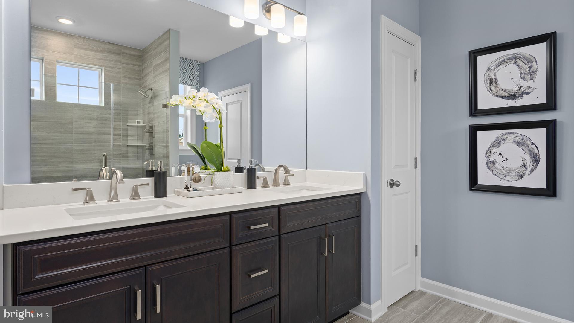 830 Reagans Road Frederick, MD 21702 - Photo 8 of 24 a bathroom with a double vanity sink and a mirror