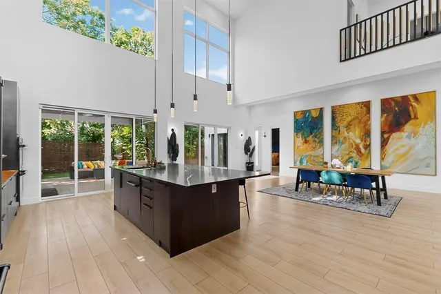 a living room with furniture and large windows