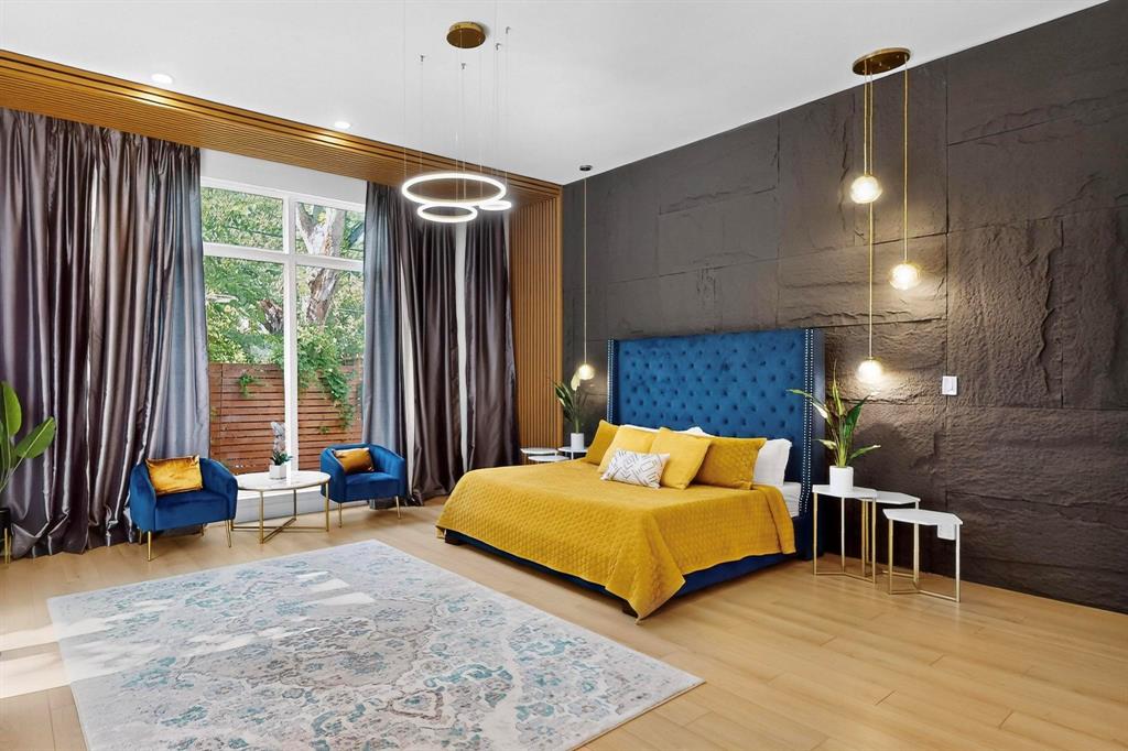 3946 North Cresthaven Road Dallas, TX 75209 - Photo 14 of 39 a bedroom with a bed and wooden floor