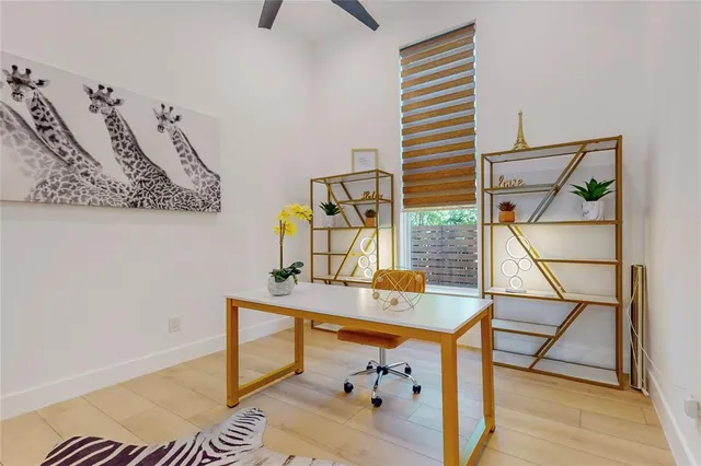 a workspace with furniture and window