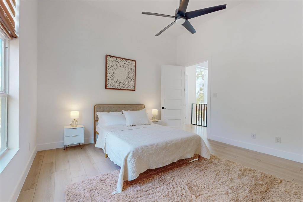 3946 North Cresthaven Road Dallas, TX 75209 - Photo 20 of 39 a bedroom with a bed and painting on the wall