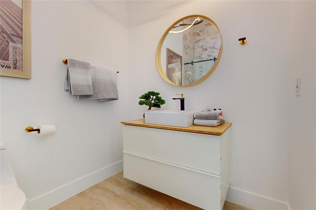 3946 North Cresthaven Road Dallas, TX 75209 - Photo 28 of 39 a bathroom with a sink mirror and vanity
