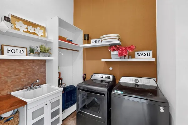 a room with a sink and cabinets
