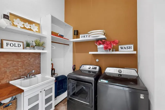 a room with a sink and cabinets