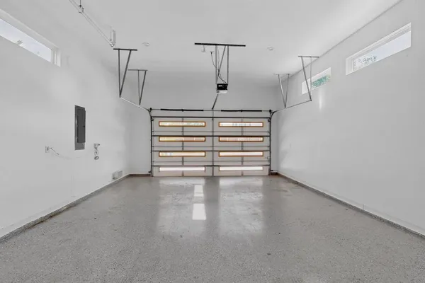 a view of empty room with stairs and white walls